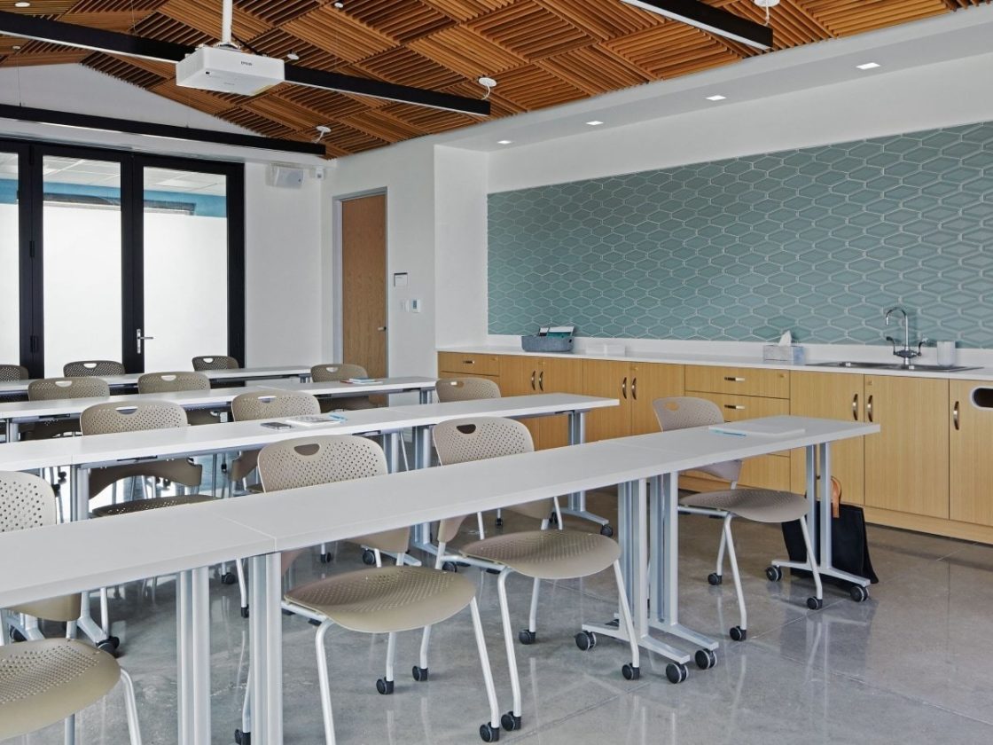 Community classroom with Everywhere mobile tables with Caper Stacking Chairs with Mora casework along the side wall