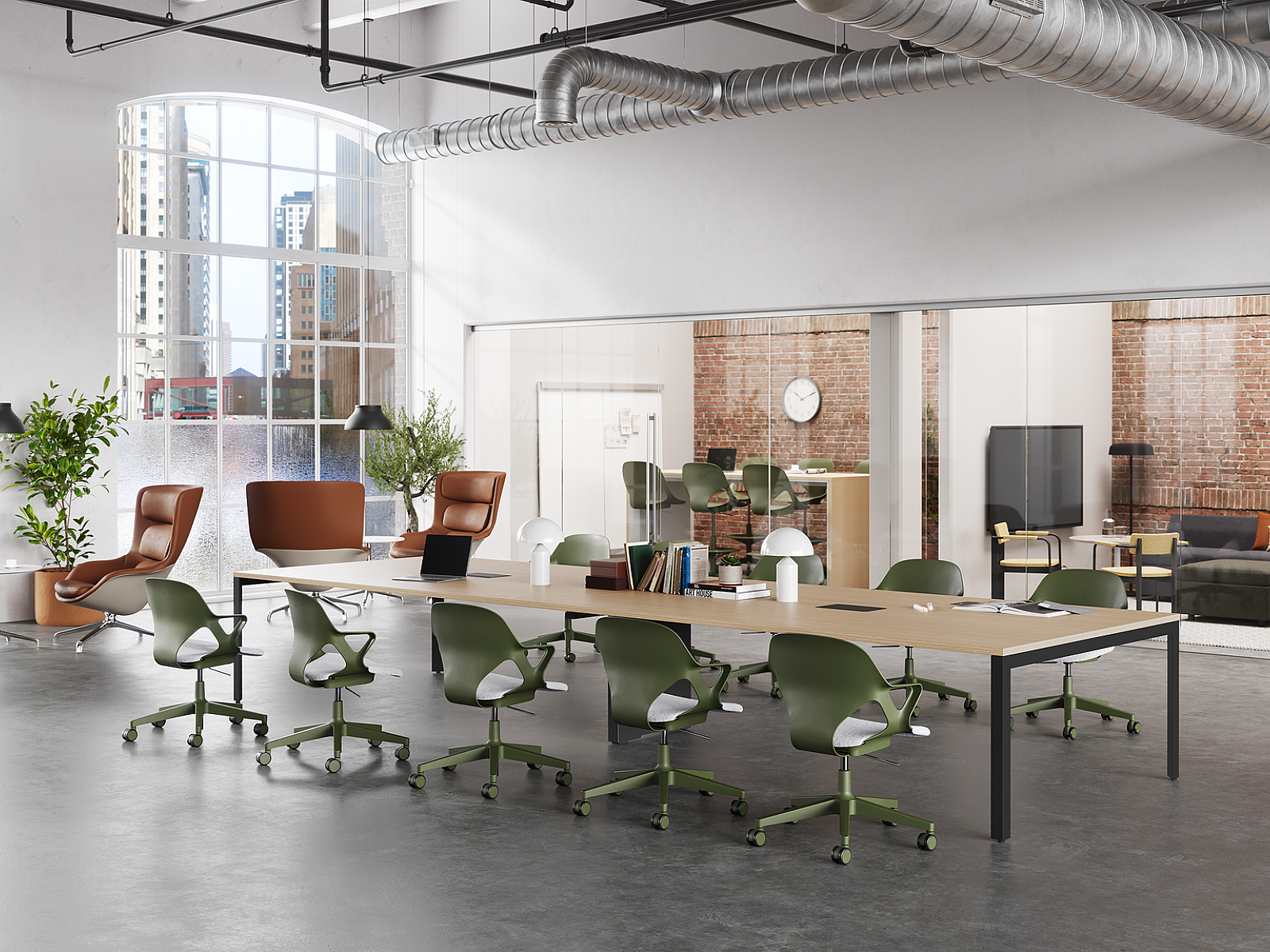 Modern office with a large table, green chairs, arched windows, exposed ductwork, brick walls, leather lounge chairs, and a glass-walled meeting area.