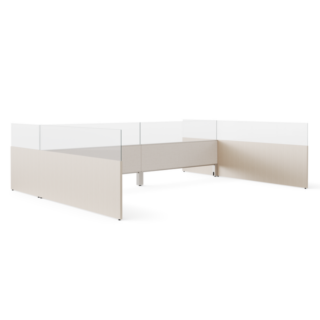 Modular office workstation with privacy panels and clear glass screens in a light neutral finish.