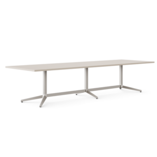 Long conference table with slim light top and modern metal trestle legs on white background.